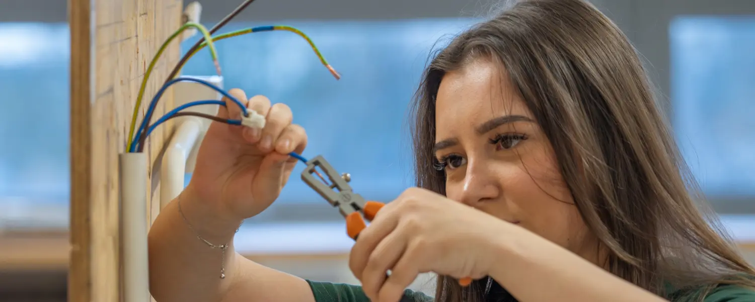 Electrical Installation student with tools